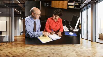 businessman and businesswoman in office. Wall mural