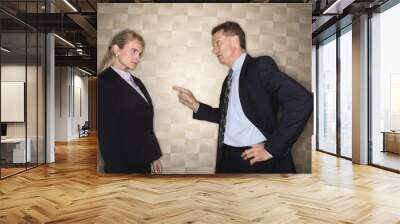 businessman reprimanding businesswoman Wall mural