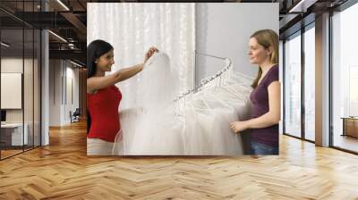 Friends shopping for veils. Wall mural