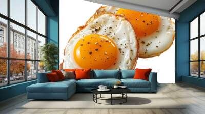 two fried eggs with spices on them Wall mural