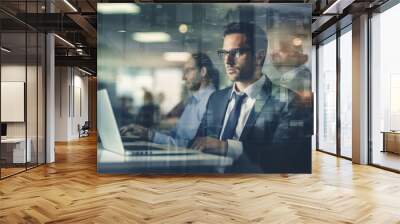 With laser focus, a businessman works on his laptop, framed by glowing digital overlays, indicative of technological sophistication. Wall mural