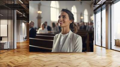 Woman in contemplation during a peaceful church service Wall mural