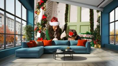 happy smiling family on Christmas at house with gifts, young mother and little son in Santas red hat, lifestyle holiday people concept Wall mural