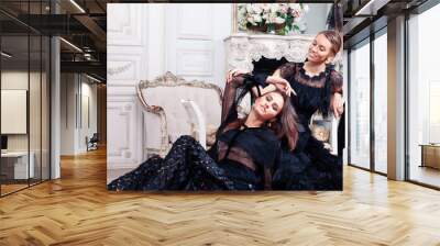 two young pretty lady in black lace fashion style dress posing in rich interior of royal hotel room, luxury lifestyle people concept Wall mural