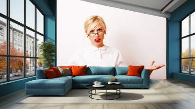 very emotional businesswoman in glasses, blond hair on white bac Wall mural