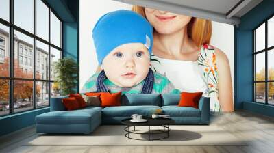 young beauty mother with cute baby, red head happy modern family smiling isolated on white background close up, lifestyle people concept Wall mural