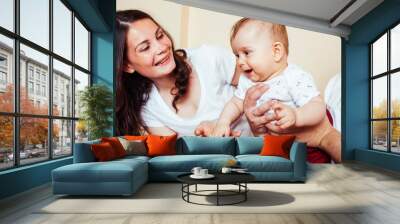 young happy modern family smiling together at home. lifestyle people concept, mother, father and little son Wall mural