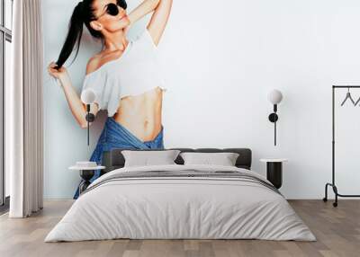 young pretty stylish hipster girl posing emotional isolated on w Wall mural