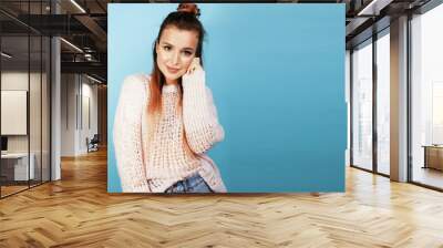 young pretty woman cheerful happy smiling, posing on blue backgr Wall mural