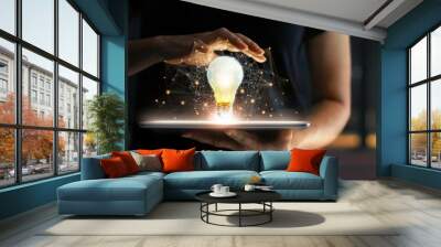  Abstract business. Human hands holding light bulb glowing on tablet and network connection communication on virtual interface, Innovation and technology concept. Wall mural