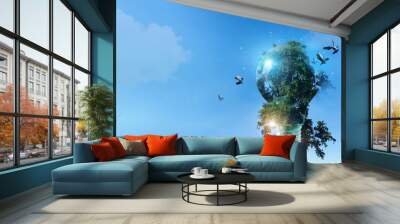 .Environment friendly, Light bulb with green tree and birds fly of freedom, Sustainable development, ecology and environment protection, Earth day, Renewable energy and recycling, Save energy. Wall mural