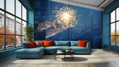 Businessman holding and using a digital tablet device with glowing light bulb on network connectivity, Science, Innovation, Idea and creativity concept. Wall mural