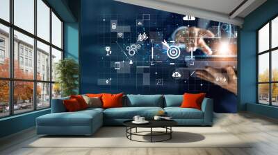 Businessman using laptop and touching a transparent rocket is launching and flying out, Business start up, Icon marketing on modern virtual interface. Wall mural