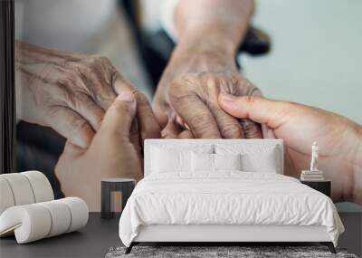 close up hands of helping hands elderly home care. mother and daughter. mental health and elderly ca Wall mural