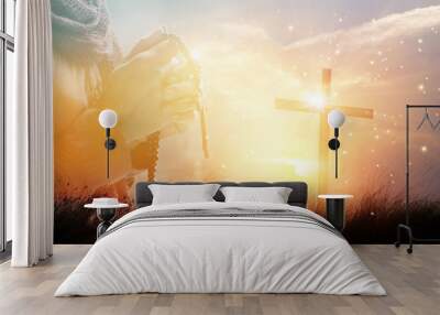 Double exposure. Woman with cross praying on nature sunset background, hope concept Wall mural