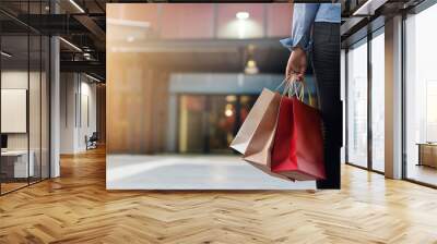 woman with shopping bags in shopping mall background. Wall mural