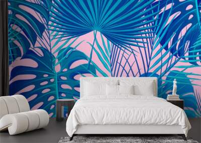 Tropical seamless pattern with exotic palm leaves. Wall mural