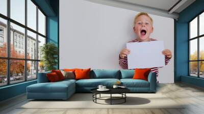 blondie cheerful 6 years old boy over white background Wall mural