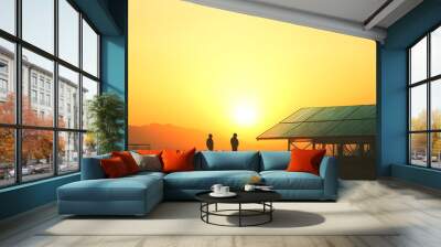 Two Silhouettes Standing by a Solar Panel Structure at Sunset Wall mural