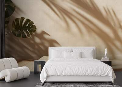 wood podium with tropical leaf on beige background Wall mural