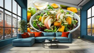 Autumn harvest salad with apple and roasted pumpkin seeds Wall mural