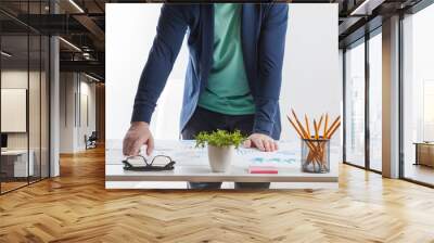 stock market chart and finger pointing on tablet in office Wall mural