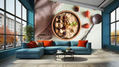 Homemade porridge with nuts and berries Wall mural