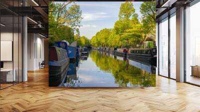 Photo of the canal of Little Venice in London with boats and green trees during a sunny day Wall mural