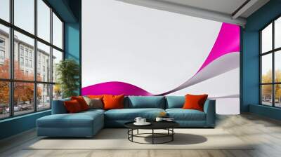 Abstract 3D composition of curved pink and white paper sheets creating a dynamic wave-like form on white background. Minimalistic design with copy space Wall mural