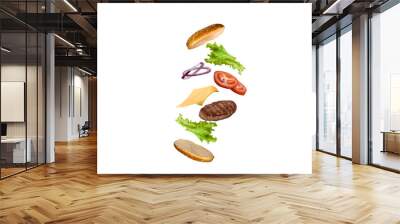 Delicious burger with flying ingredients isolated on white background. Wall mural