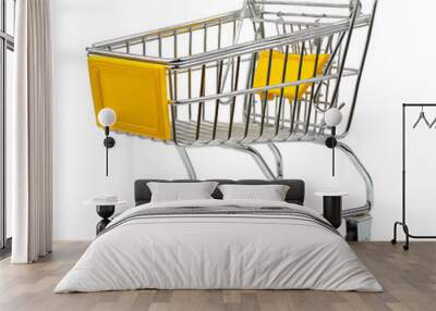 A shopping cart with a yellow handle and a yellow basket Wall mural