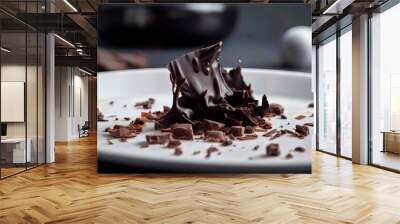 close-up shot of a piece of dark chocolate flakes on a delicious white plate Wall mural