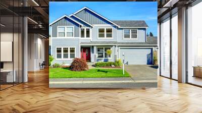 Big two story house. View of entance porch and garage Wall mural