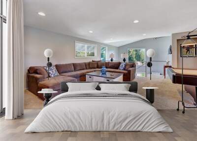 Cozy game room with brown sectional sofa Wall mural