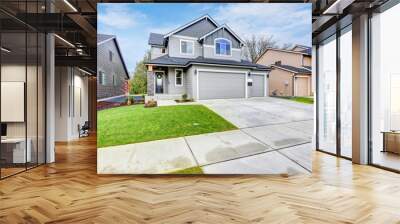 Grey house exterior on a blue sky background Wall mural