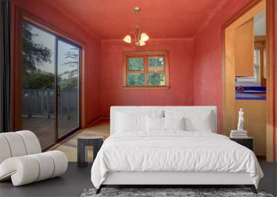 Hallway interior in red tones with hardwood floor. The room has exit to balcony. Wall mural