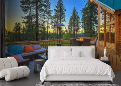 Luxury summer evening mountain home eteriors with cozy porch fire table and new furniture design. Wall mural