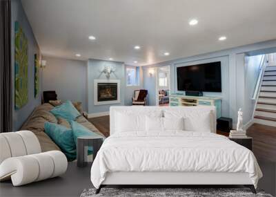 Pastel blue walls in basement living room interior. Wall mural