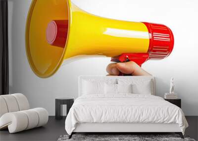 A person holding a bright yellow and red megaphone in a lively outdoor environment during a community event Wall mural