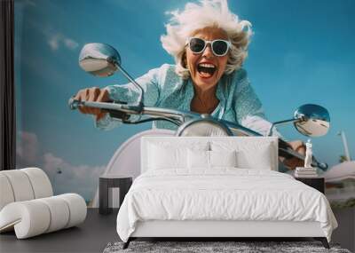 Cheerful senior woman riding blue scooter in Italy, retired granny enjoying summer vacation, trendy bike road trip Wall mural