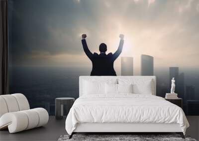 Successful businessman raising arms like a winner standing on roof of office building with city view. Concept of business success and victory. Generative AI Wall mural