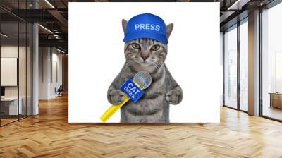 A gray cat journalist in a blue cap with a microphone. White background. Isolated. Wall mural