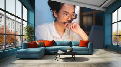 Asian female businesswoman, manager or employee feel stress and serious while working on desk. Concept of exhausted from deadline work, overwork document or overtime late at night. tired of night job. Wall mural