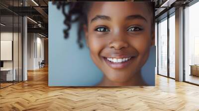  close-up portrait of happy black girl on gray background Wall mural