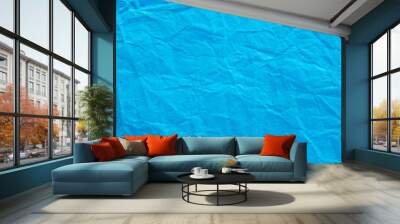 A sheet of wrinkled glossy blue paper texture as background Wall mural