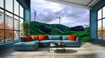 Breathtaking landscape of lush green hills and wind farm against blue sky and white clouds. Concept of alternative energy and sustainability. Palmerston North, New Zealand Wall mural