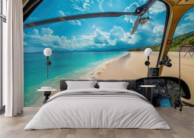 Inside view of a helicopter cockpit flying over a tropical beach with turquoise water and blue sky. Wall mural