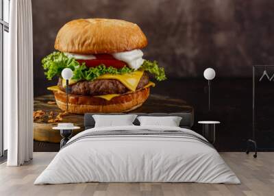 Close-up of home made tasty burger on wooden table. Wall mural