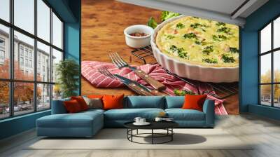 Homemade quiche with red fish, salmon, broccoli and cheese on wooden background Wall mural