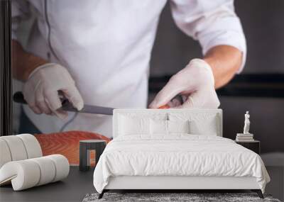 Chef cutting fresh salmon Wall mural